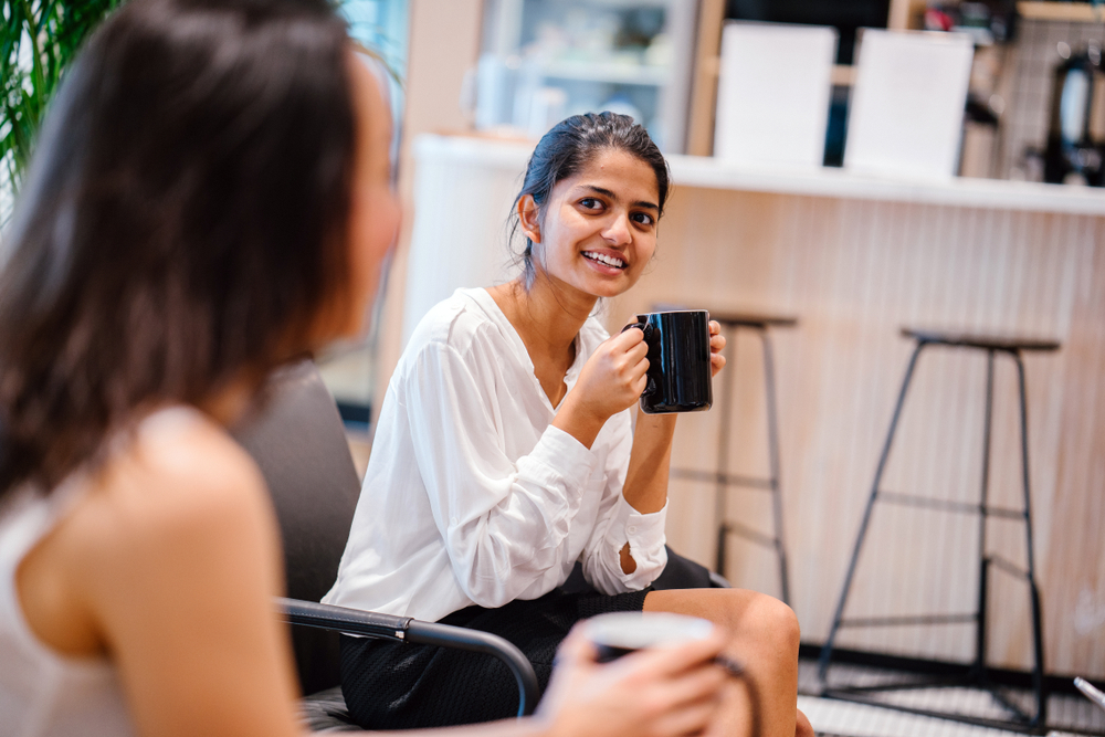 woman taking break at work with coffee