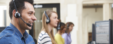 call center employees with headsets on