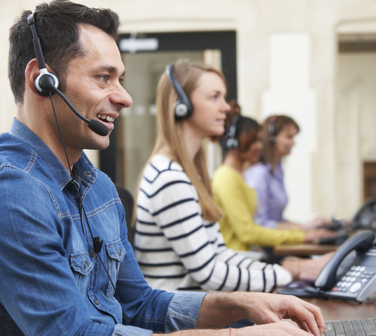call center employees with headsets on