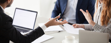 employees arguing in meeting