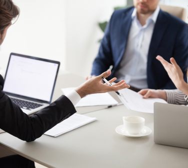 employees arguing in meeting