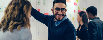 employee smiling with team mates