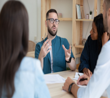 boss having meeting with employees