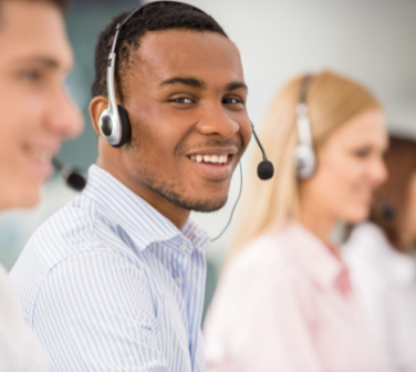 african american customer service agent on phone with headset on