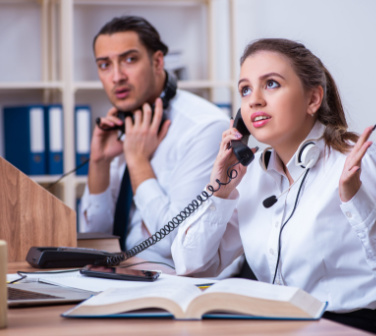 call center agent talking on phone to angry customer