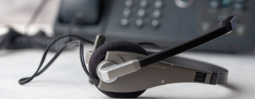 headset on desk near phone