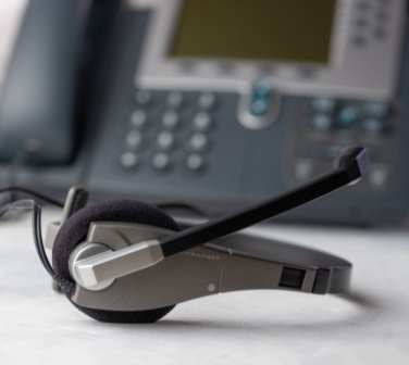 headset on desk near phone