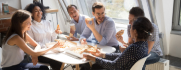 Employees celebrate with a pizza party