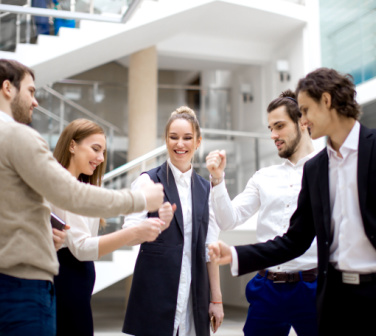 Group of employees giving fist bumps
