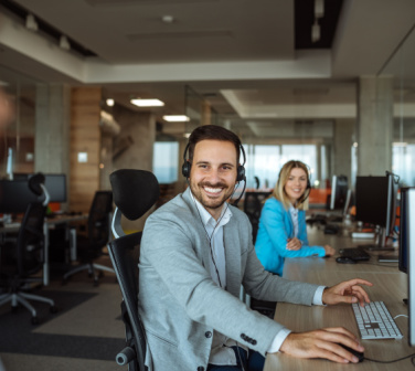 smiling male call center employee