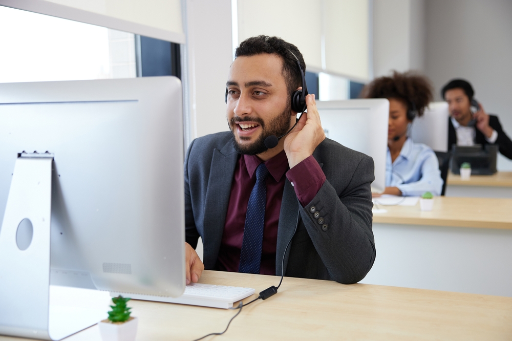 Call center male employee working at the call center