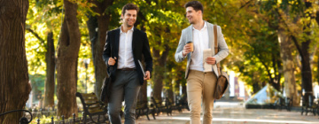 Two men walk to work and talk