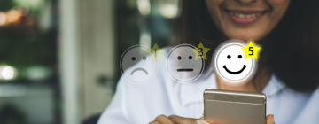 Smiling face of customer rating a company highly - call center jobs in Tijuana.