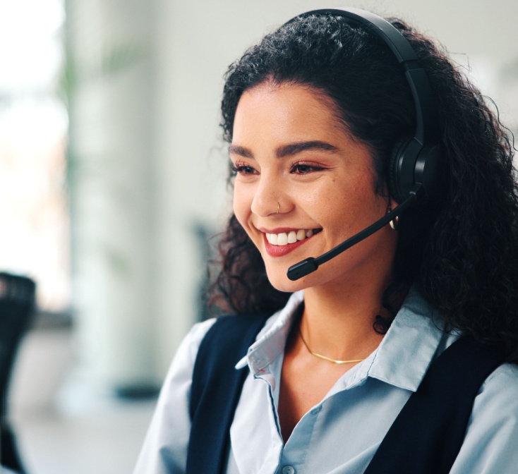 Call center, headset and woman with smile, consultation and help desk with system solution. Happy person, employee and agent in office, discussion and contact us with customer support and feedback.
