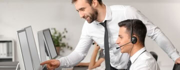 Supervisor at call center helps employes with continuous training - best call center in Tijuana.