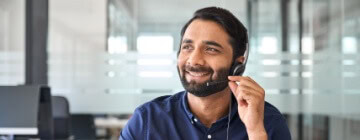 Agent smiling, understanding the importance of customer service in the success of their career - best call center in Tijuana