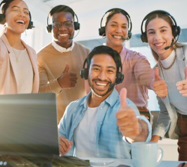 Global call center team in Mexico with members smiling - Best Call Center in Tijuana