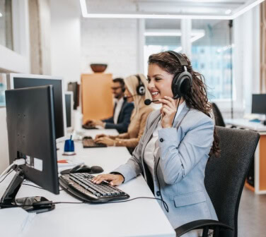 Team of call center employees working together on office - Seguros Confie, Best Call Center in Tijuana.