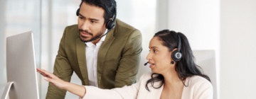 Man and women in a call center showing their experience - Seguros Confie, Best Call Center in Tijuana.