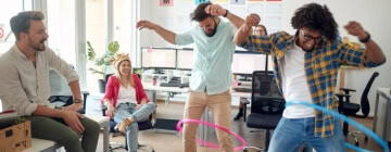 Employees at a call center in Tijuana engage in light-hearted games to reduce stress.
