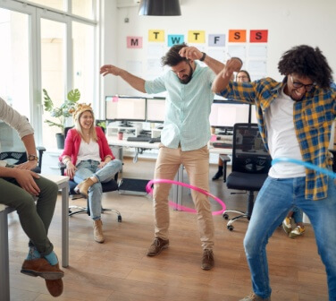 Employees at a call center in Tijuana engage in light-hearted games to reduce stress.