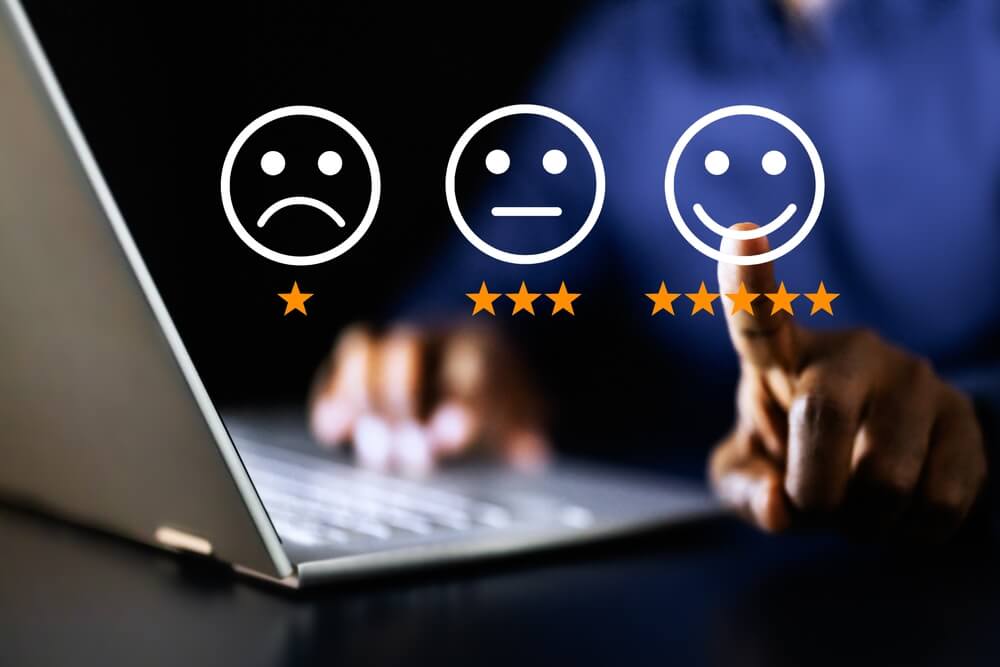 Graphic of customer service finger choosing smiling face.