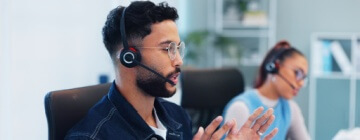 Call center agent talking with customer about support, advice and online consultation.