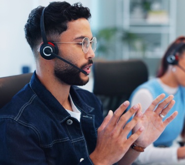 Call center agent talking with customer about support, advice and online consultation.