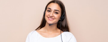 Smiling Hispanic call center worker.