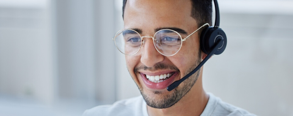 Customer service rep Hispanic man smiling