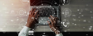 Image of a man's hands on a laptop with illustrative images floating around illustrating omnichannel communication - best call center jobs in Tijuana.