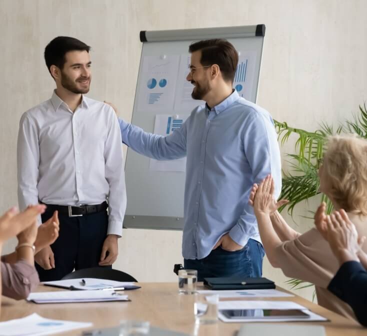 Company leader introduces new worker to the group - best call center jobs in Tijuana.