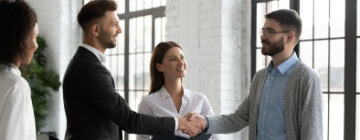 New employee shaking hands and meeting the team - best call center jobs in Tijuana.