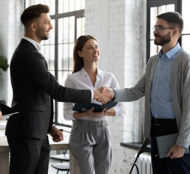 New employee shaking hands and meeting the team - best call center jobs in Tijuana.