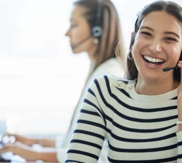 Smiling call center worker helps an angry customer - best call center job in Tijuana.