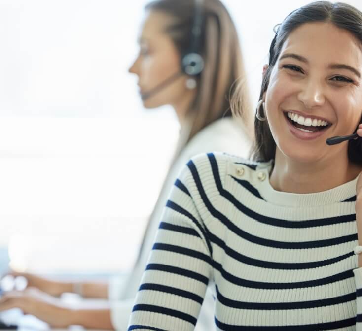 Smiling call center worker helps an angry customer - best call center job in Tijuana.