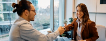 Young Hispanic man has an interview for a call center job with a young woman - best call center job in Tijuana.