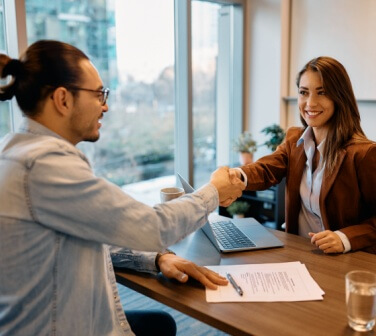 Young Hispanic man has an interview for a call center job with a young woman - best call center job in Tijuana.