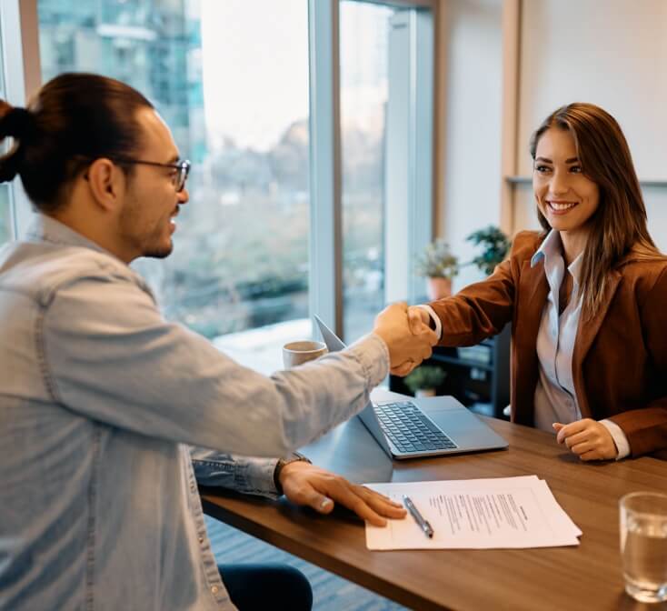 Young Hispanic man has an interview for a call center job with a young woman - best call center job in Tijuana.