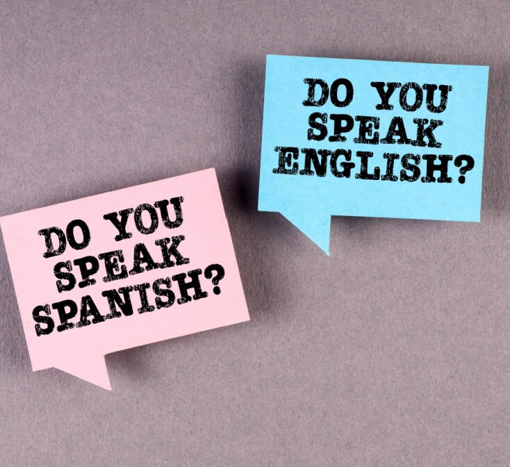 Two signs on a background saying do you speak English do you speak Spanish, illustration of bilingual - best call center in Tijuana.