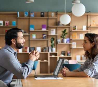 Male HR specialist manager, employer, boss listening to female candidate at her first job interview. Hiring and employment, human resources, recruitment concept.