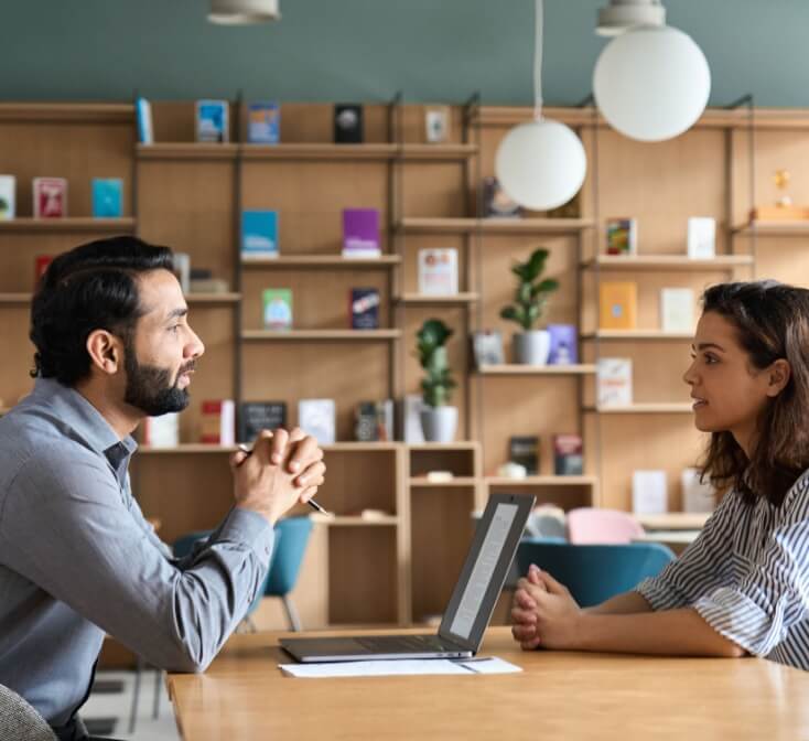 Male HR specialist manager, employer, boss listening to female candidate at her first job interview. Hiring and employment, human resources, recruitment concept.