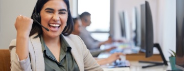 Customer service support operator showing thumbs up wearing headset with hidden skills you gain in a call center job-1