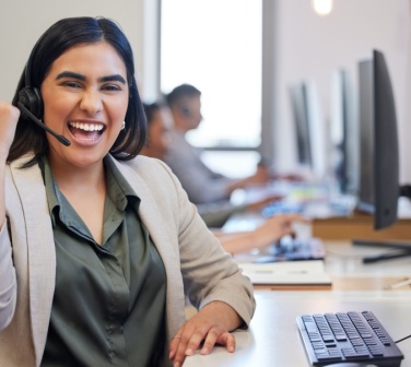 Customer service support operator showing thumbs up wearing headset with hidden skills you gain in a call center job-1