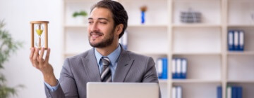 Young male employee in time management concept. Best call center job in Tijuana.