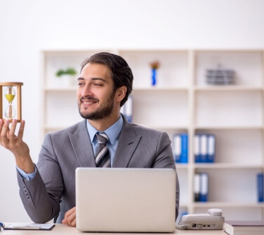 Young male employee in time management concept. Best call center job in Tijuana.