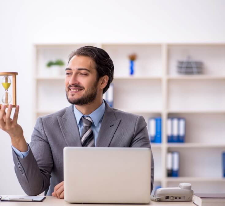 Young male employee in time management concept. Best call center job in Tijuana.
