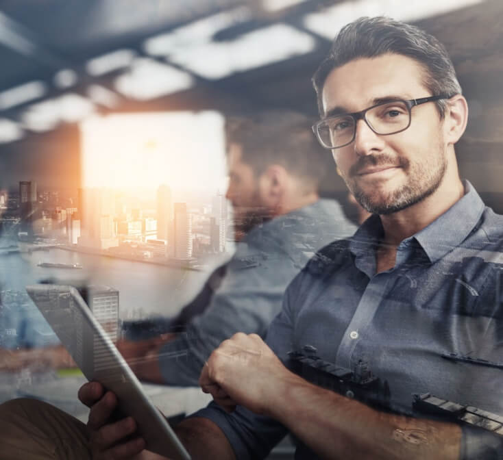 Carving his own career path. Multiple exposure shot of businesspeople in an office superimposed on a cityscape.
