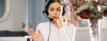 Support representative working quietly with a headset and laptop, representing call center jobs for introverts who prefer structured, one-on-one interactions - 1