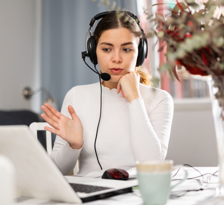 Support representative working quietly with a headset and laptop, representing call center jobs for introverts who prefer structured, one-on-one interactions - 1